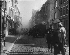 French Refugees Walking Through a Ruined Town, 1940. Creator: British Pathe Ltd.