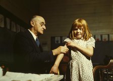 Dr. Schreiber of San Augustine giving a typhoid innoculation..., San Augustine County, Texas, 1943. Creator: John Vachon.