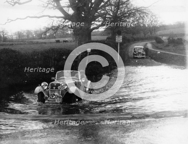 1935 Singer 1.5 Litre Le Mans taking part in a water splash trial, (1935?). Artist: Unknown