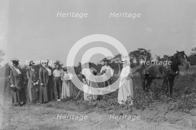 Mrs. T.B. Wells, Mrs. D.A. Palmer & Mary G. Hay -- suffrage farm, 1917. Creator: Bain News Service.