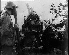 Two Male German Soldiers by an Artillery Gun, 1939. Creator: British Pathe Ltd.