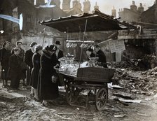 A fruit stall in a bomb wrecked clearing, London, World War II, c1940-c1945. Artist: Unknown