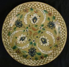 Dish with Floral Designs on an Olive Background, Iran, 16th-17th century. Creator: Unknown.