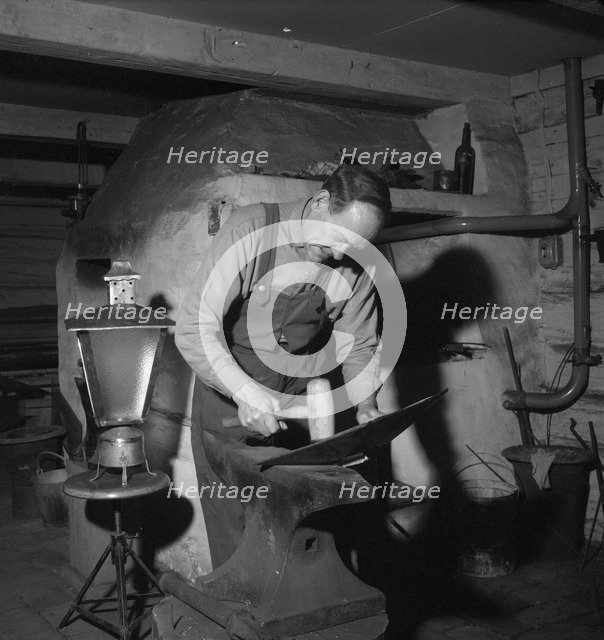 Blacksmith at work, Esklistuna, Södermanland, Sweden, 1960. Artist: Torkel Lindeberg