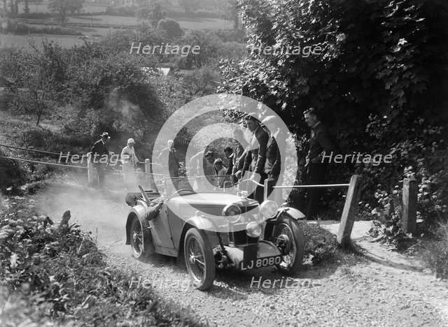 1933 MG J1 taking part in a West Hants Light Car Club Trial, Ibberton Hill, Dorset, 1930s. Artist: Bill Brunell.