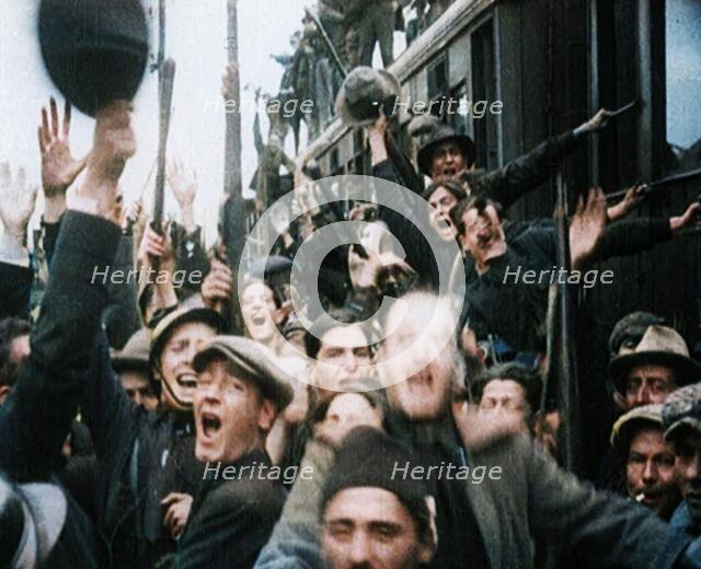 Italian Soldiers Standing on or Near a Train, Waving and Cheering, 1922. Creator: British Pathe Ltd.