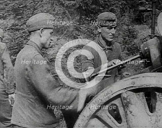 German Soldiers Operating an Artillery Gun, 1941. Creator: British Pathe Ltd.