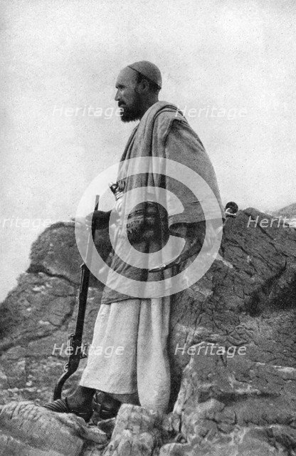 An Afridi lookout, Khyber and Kohat Pass, Pakistan and Afghanistan, 1922.Artist: Holmes & Co.