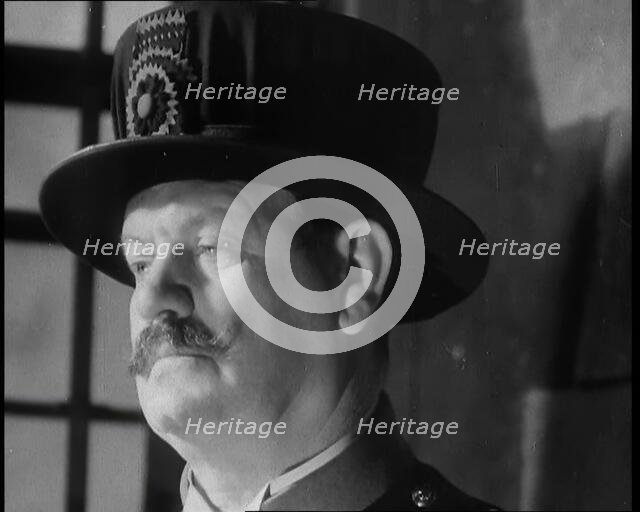 Beefeater guarding the Crown Jewels at the Tower of London, 1937.  Creator: British Pathe Ltd.