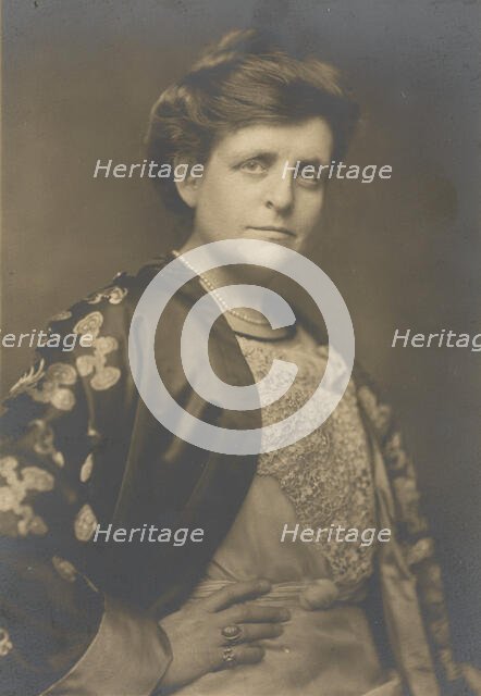 Frances Benjamin Johnston, half-length portrait, turned to the right, facing front, with..., 1911. Creator: William H Towles.