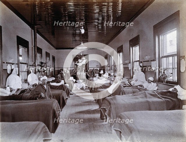 Johannesburg Hospital, South Africa: hospital ward with male patients, many with bandaged...c1905. Creator: Unknown.