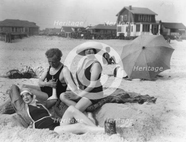 Arnold Genthe with two women friends in Long Beach, New York, between 1911 and 1942. Creator: Arnold Genthe.