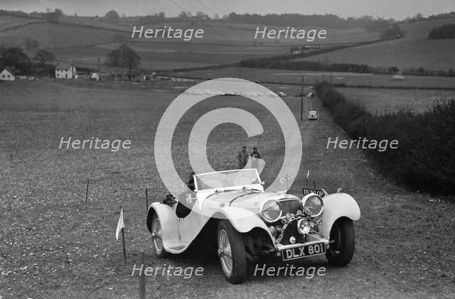 Jaguar SS100 at the Standard Car Owners Club Southern Counties Trial, 1938. Artist: Bill Brunell.