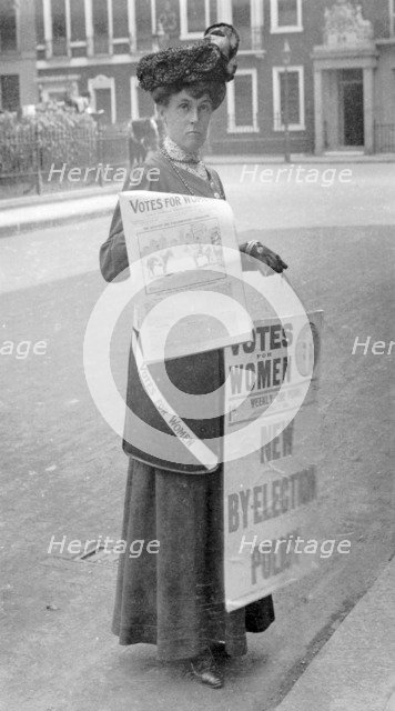 Miss Kelly selling Votes for Women in central London, July 1911. Artist: Unknown