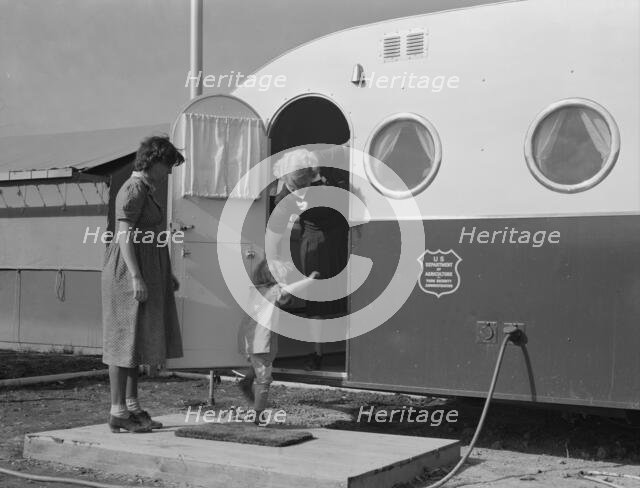 Young mother brings her child to the trailer clinic..., FSA, Merrill, Klamath County, Oregon, 1939. Creator: Dorothea Lange.