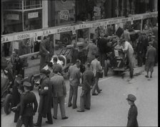 Crowds at a Motor Race in Ireland, 1936. Creator: British Pathe Ltd.