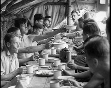 Men Eating Under a Canopy, 1933. Creator: British Pathe Ltd.