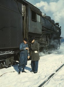 Railroad conductor George E. Burton and engineer J.W. Edwards...Chicago, Ill., 1943. Creator: Jack Delano.