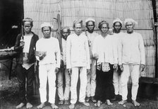 Philippines - Moro Datu And His Followers, 1913. Creator: Harris & Ewing.