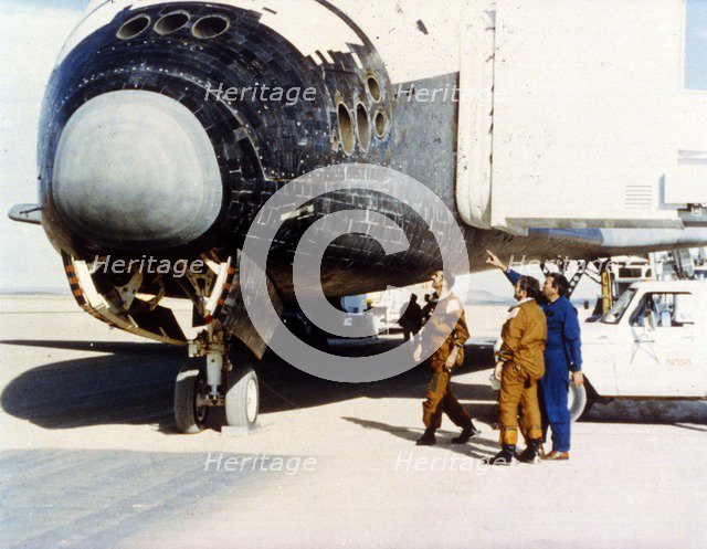 Inspecting heat tiles, second Space Shuttle flight, November 1981. Creator: NASA.