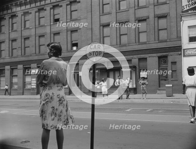 Waiting for the street car at 7th and Florida Avenue, N.W., Washington, D.C., 1942. Creator: Gordon Parks.