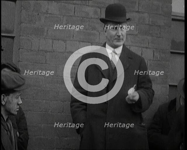 Man in a Bowler Hat Speaking to Crowds, 1920. Creator: British Pathe Ltd.
