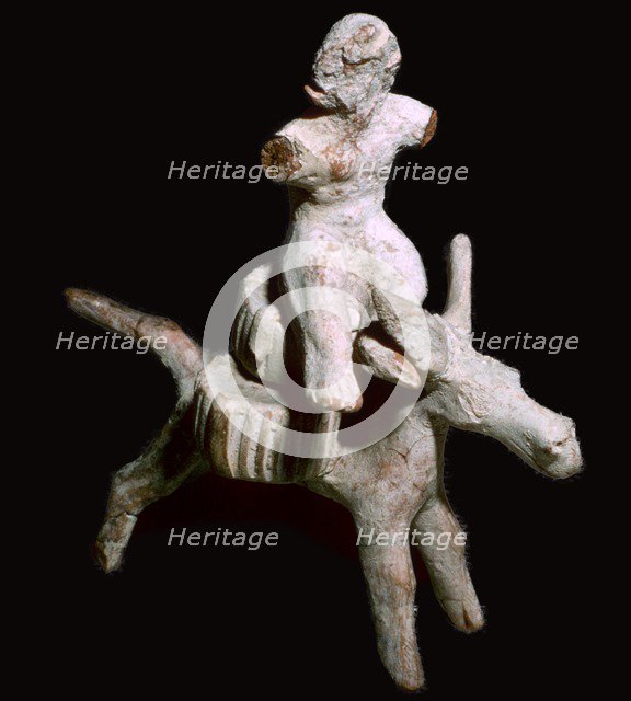 Greek terracotta figure of a man seated on three cheese on top of a mule, Corinthian. Artist: Unknown