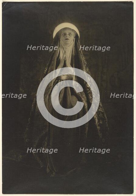 Portrait of a Woman Wearing a Long, Veiled Hat, about 1922. Creator: Francis Joseph Bruguiere.