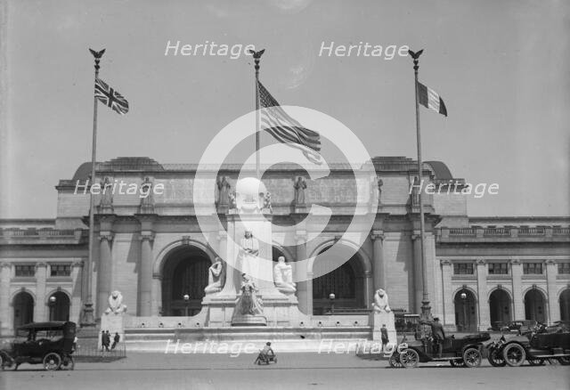 Flags - American, British, And French Flags in Front of Union Station, Awaiting Arrival..., 1917. Creator: Harris & Ewing.