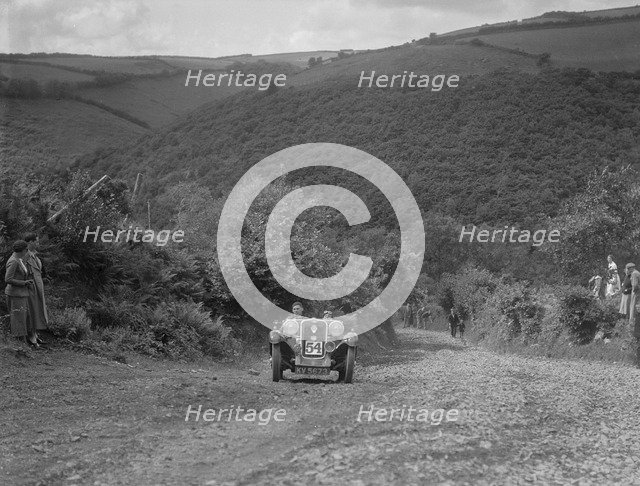Singer 2-seater competing in the Mid Surrey AC Barnstaple Trial, Beggars Roost, Devon, 1934. Artist: Bill Brunell.