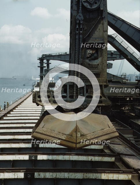 Pennsylvania R.R. ore docks, unloading iron ore from a lake freighter..., Cleveland, Ohio, 1943. Creator: Jack Delano.