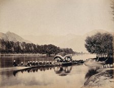 Srinagar, Kashmir: a large rowing boat proceeding along an inland waterway, c1870s. Creator: Samuel Bourne.
