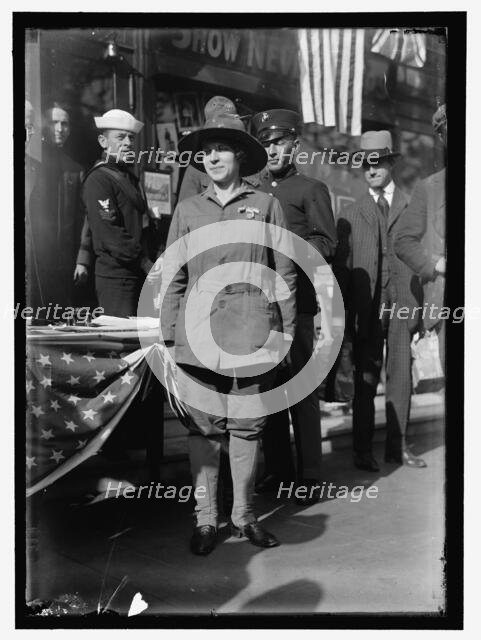 Dora Rodrigues, recruiter for service branches, possibly in front of the Cosmos Theater..., May 1917 Creator: Harris & Ewing.
