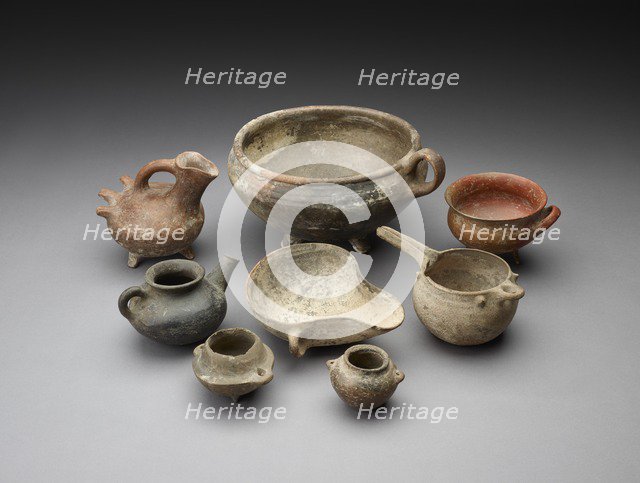 Small open mouth vessel with extended ledge and 2 handles around the body. Artist: Unknown.