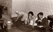 Three women scrub a stone floor on their hands and knees, 1956. Artist: Unknown