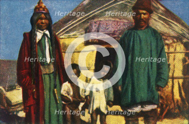 Nomads outside their yurt, west Mongolia, c1928. Creator: Unknown.