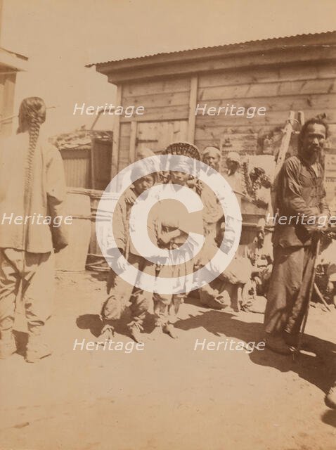 Korean children, Chinese men, and others at the farmers' market, Vladivostok, Russia, 1899. Creator: Eleanor Lord Pray.