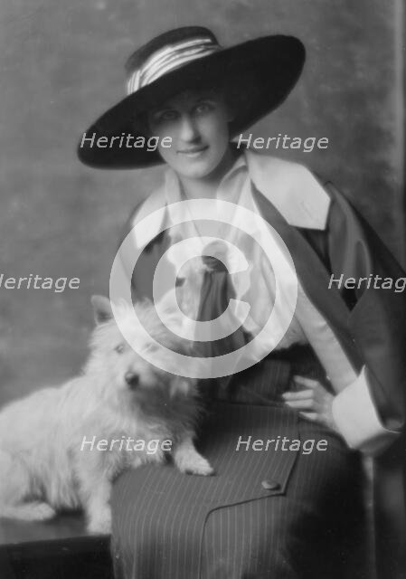 Milholland, Inez (Mrs. Eugene Boissevain), with dog, portrait photograph, 1914. Creator: Arnold Genthe.