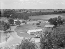 Entrance to camp showing clinic, Farmersville, California, 1939. Creator: Dorothea Lange.