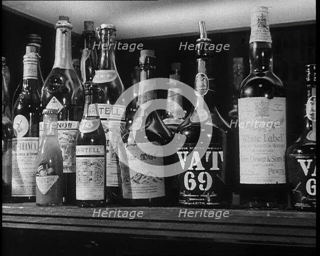Row of Spirits Lined up on a Shelf, 1933. Creator: British Pathe Ltd.