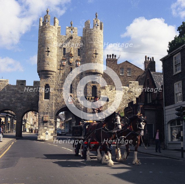Tetley shire horses and dray in front of Micklegate Bar, York, North Yorkshire, 1969.  Artist: Michael Walters