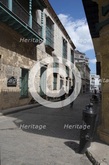 Street scene with couple in the distance, Havana, Cuba, 2024. Creator: Ethel Davies.