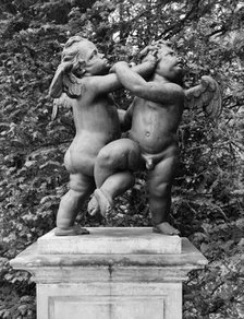 'Cherubs - the Quarrel', statue in the gardens of Melbourne Hall, Derbyshire, 1954. Artist: GB Mason.