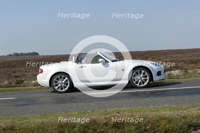 2014 Mazda MX5 Roadster Coupe Artist: Unknown.