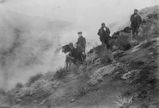 Photographers on hillside photographing Mt. Etna eruption, 1910. Creator: Bain News Service.