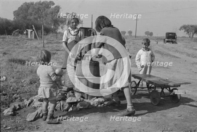 Water supply, American River camp, California, San Joaquin Valley, CA, 1936. Creator: Dorothea Lange.