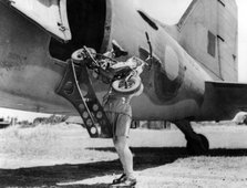 1944 Welbike being placed on to military transport plane. Creator: Unknown.