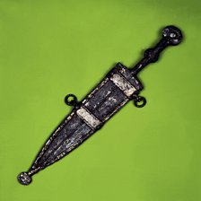 Bispherical dagger with cold meat decoration in silver on the scabbard. It comes from the Necropo…