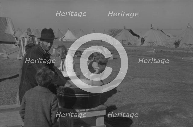 Facilities for washing in the camp for white flood refugees at Forrest City, Arkansas, 1937. Creator: Walker Evans.