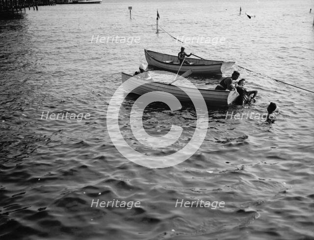 Saving a life, between 1900 and 1905. Creator: Unknown.